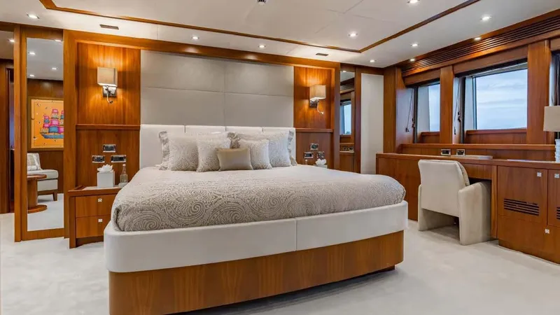 Mercy Yacht Photos Pics Luxurious bedroom interior on a 2009 Sunseeker 37 Metre Yacht, featuring elegant wood finishes.