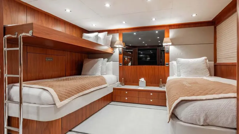 Mercy Yacht Photos Pics Luxurious twin cabin interior on 2009 Sunseeker 37 Metre Yacht, featuring elegant wood finishes.