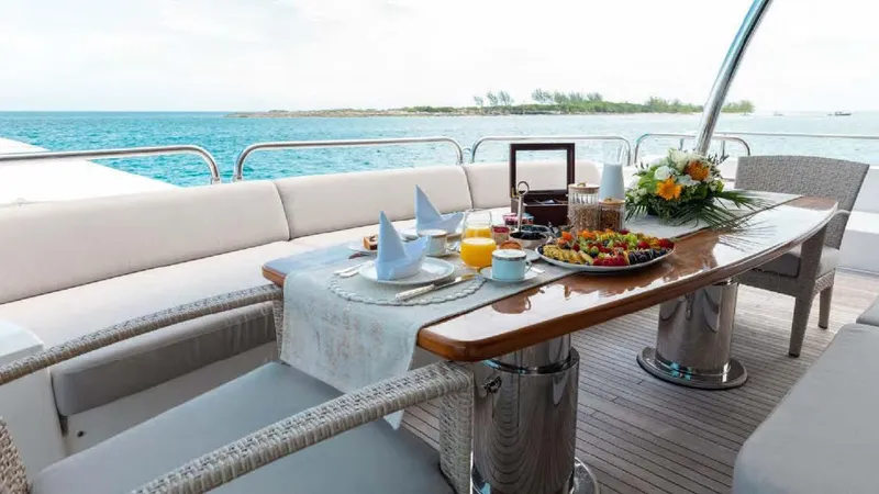 Mercy Yacht Photos Pics Luxurious dining setup on 2009 Sunseeker 37 Metre Yacht with ocean view.