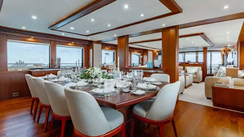 Mercy Yacht Photos Pics Luxurious dining area on 2009 Sunseeker 37 Metre Yacht with elegant table setting.