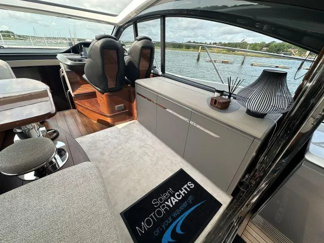  Yacht Photos Pics Princess V50 - 3 Cabin Layout - Saloon entertainment unit