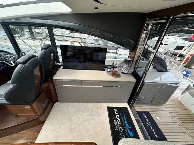  Yacht Photos Pics Princess V50 - 3 Cabin Layout - Saloon entertainment unit