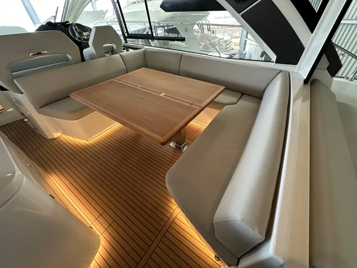 Gran Turismo 45 Yacht Photos Pics Luxurious interior of 2023 Beneteau Gran Turismo 45 yacht with elegant seating and wooden table.
