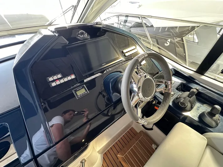 Gran Turismo 45 Yacht Photos Pics Helm of 2023 Beneteau Gran Turismo 45 yacht with modern controls and steering wheel.