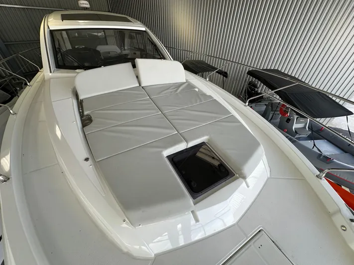 Gran Turismo 45 Yacht Photos Pics 2023 Beneteau Gran Turismo 45 yacht with sleek deck design in a modern marina setting.