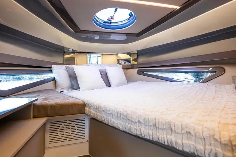  Yacht Photos Pics Luxurious interior of 2026 Hanover 415 Ultimate Luxury yacht with plush bedding and modern design.