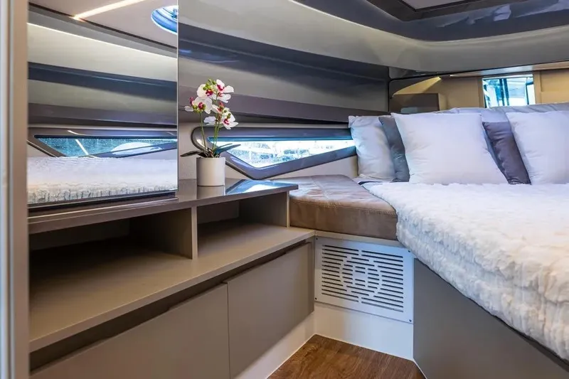  Yacht Photos Pics Luxurious interior of 2026 Hanover 415 Ultimate Luxury yacht with elegant bedding and decor.