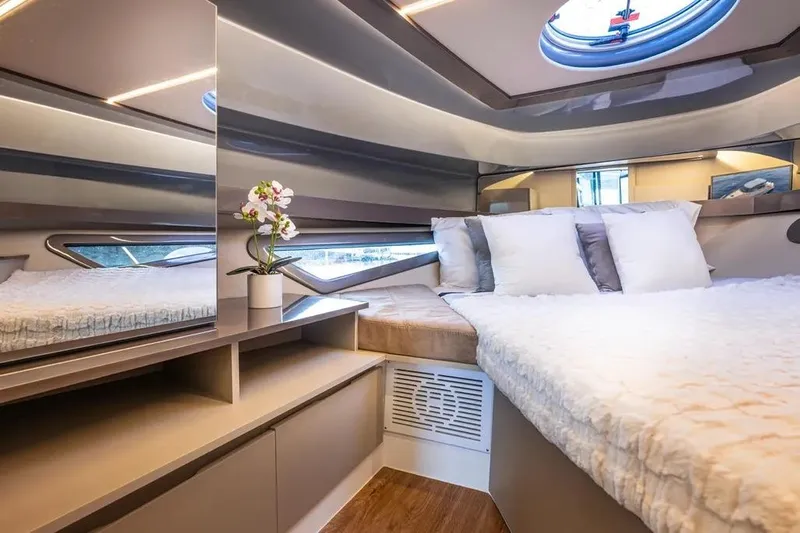  Yacht Photos Pics Luxurious interior of 2026 Hanover 415 Ultimate Luxury yacht with elegant bedding and decor.