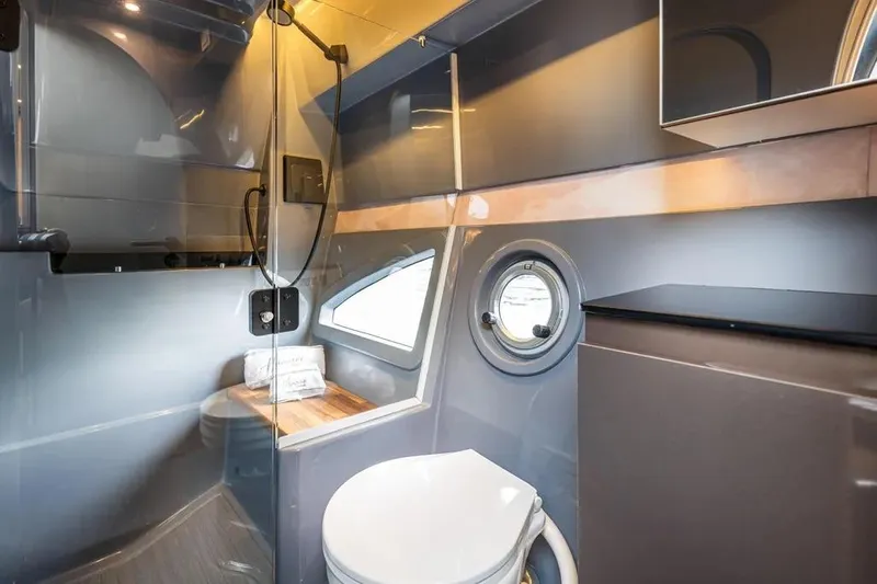  Yacht Photos Pics Luxurious bathroom in 2026 Hanover 415 Ultimate Luxury, featuring modern fixtures and sleek design.