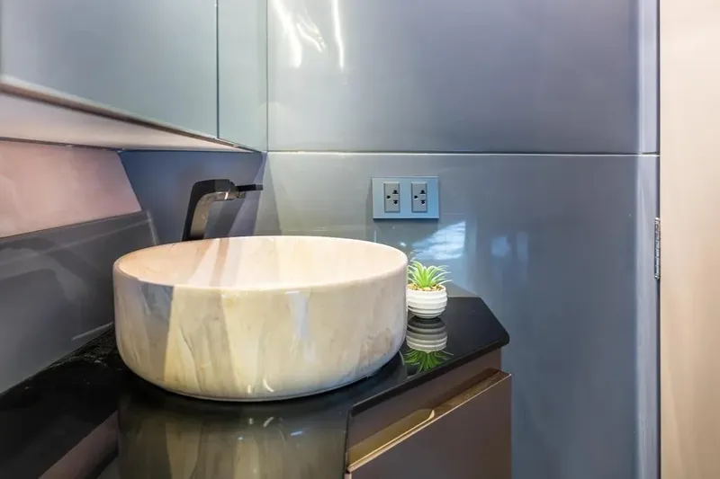  Yacht Photos Pics Luxurious bathroom sink in 2026 Hanover 415 Ultimate Luxury model, featuring modern design elements.