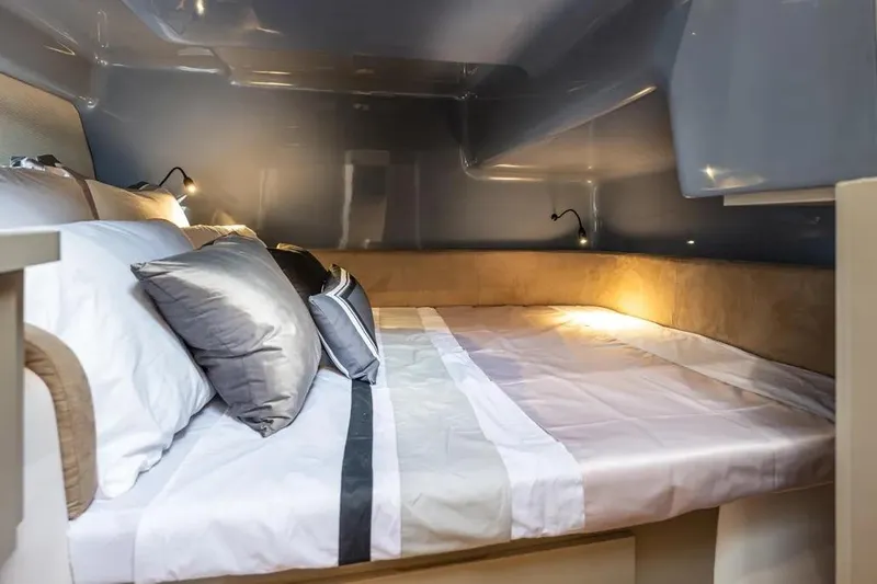  Yacht Photos Pics Luxurious interior of 2026 Hanover 415 Ultimate Luxury, featuring a cozy, well-lit sleeping area.