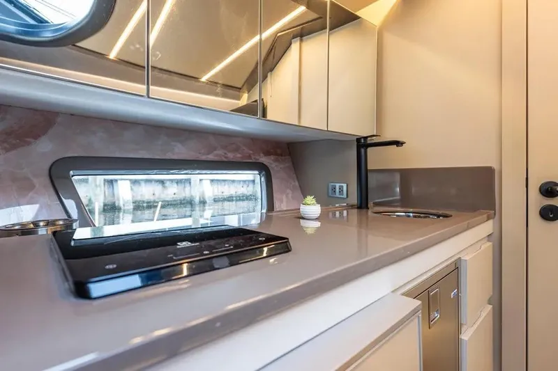  Yacht Photos Pics Luxurious interior of 2026 Hanover 415 Ultimate Luxury yacht kitchen with modern amenities.