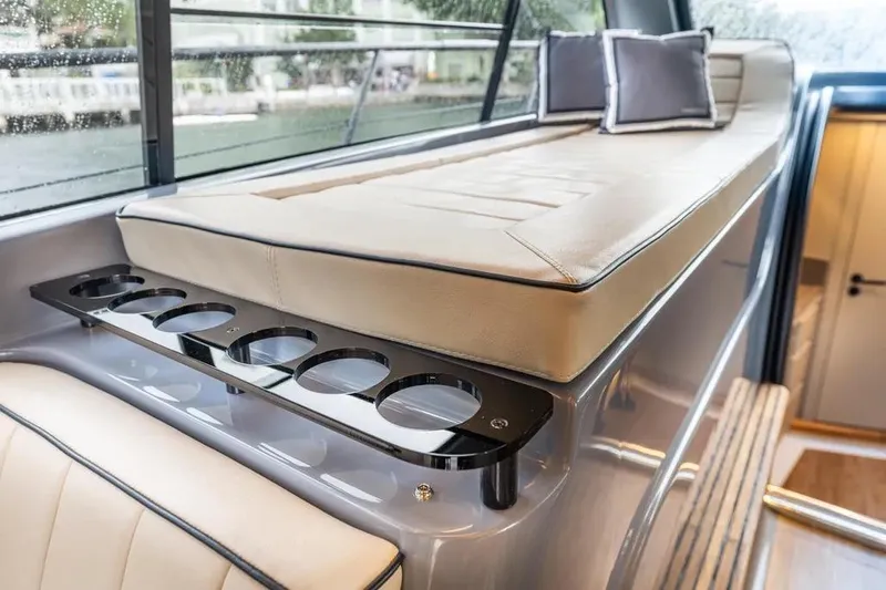  Yacht Photos Pics Luxurious interior of 2026 Hanover 415 Ultimate Luxury yacht with elegant seating and cup holders.