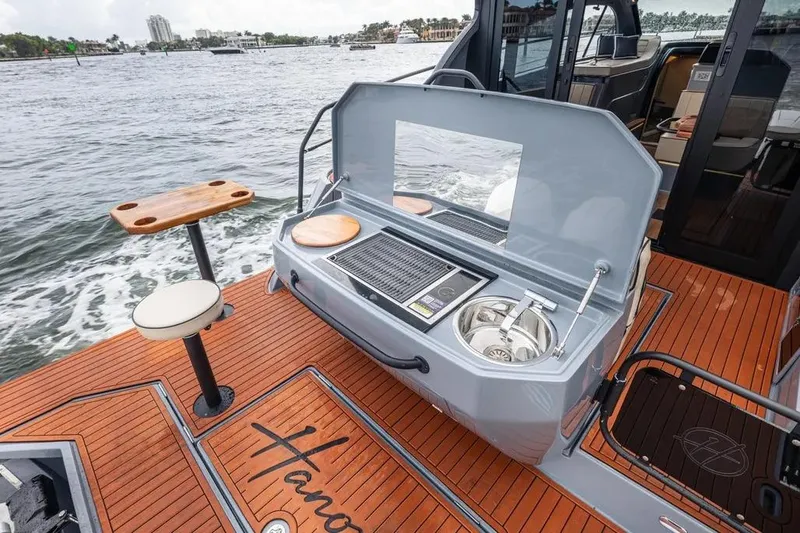  Yacht Photos Pics Luxury yacht Hanover 415 Ultimate, 2026 model, featuring outdoor kitchen and seating area.