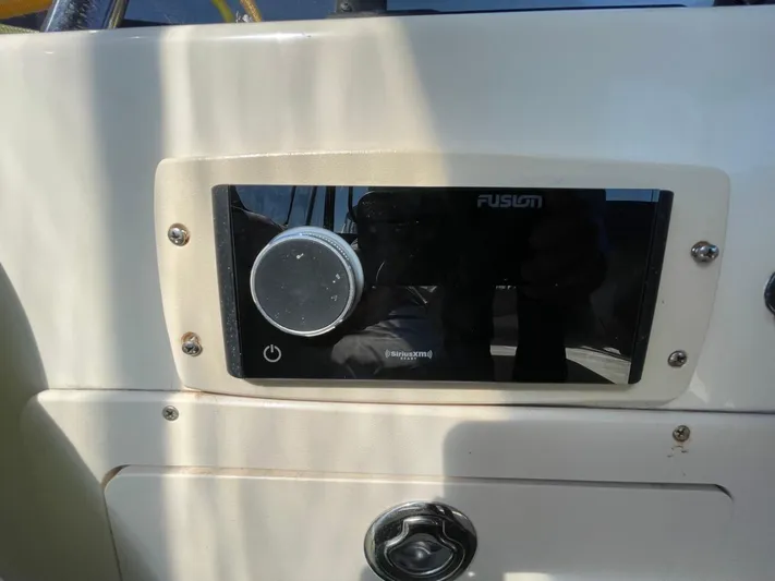 Nowhere Fast Yacht Photos Pics Control panel on 2005 Mainship 430 Aft Cabin 3SR Trawler, featuring Fusion audio system.