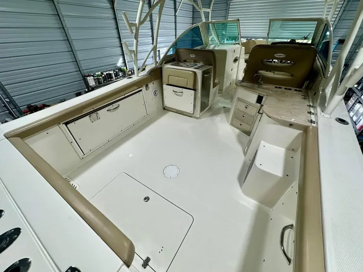  Yacht Photos Pics 2018 Sailfish 325 DC boat interior with spacious deck and storage compartments.