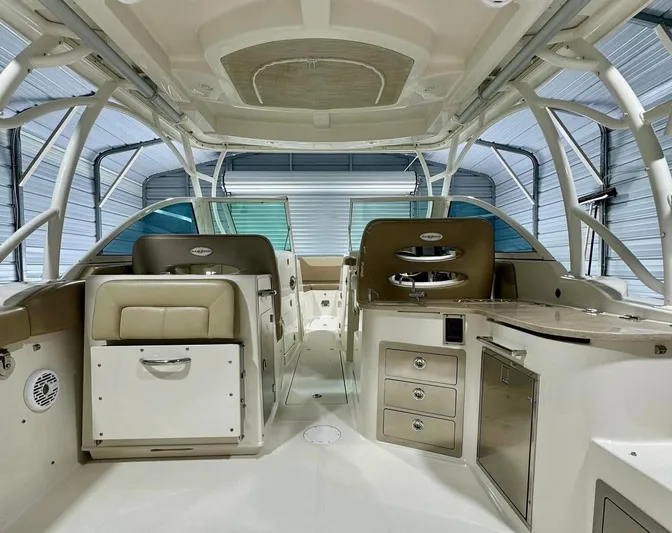  Yacht Photos Pics 2018 Sailfish 325 DC boat interior with seating, storage, and helm station.