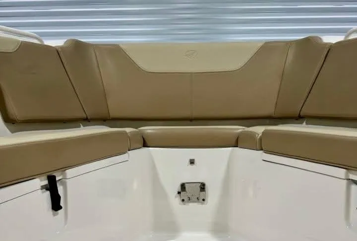  Yacht Photos Pics 2018 Sailfish 325 DC boat interior with tan seating and white accents.