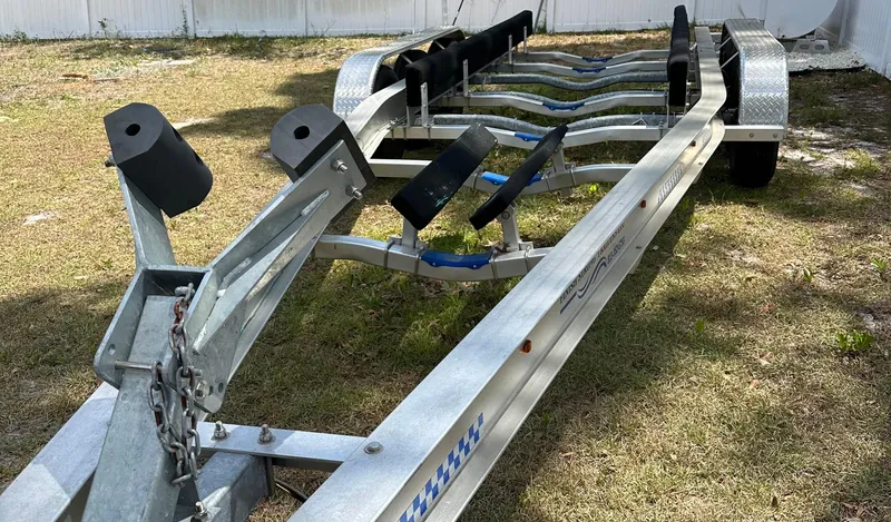  Yacht Photos Pics Boat trailer for 2018 Sailfish 325 DC on grass, ready for transport.