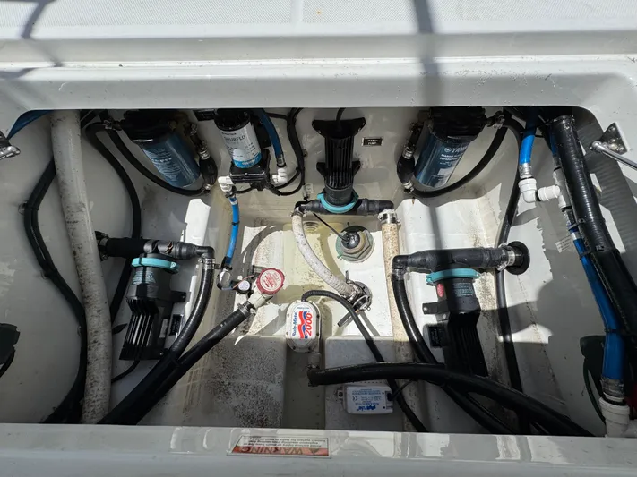  Yacht Photos Pics 2021 Blackfin 272 CC boat plumbing system with pumps and hoses.