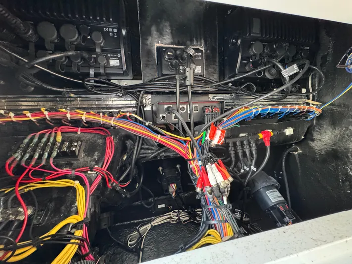 Yacht Photos Pics Electrical wiring system inside a 2021 Blackfin 272 CC boat, showcasing organized cables and connections.