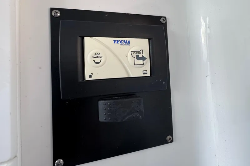  Yacht Photos Pics Control panel on a 2021 Blackfin 272 CC boat, featuring Tecma toilet controls.