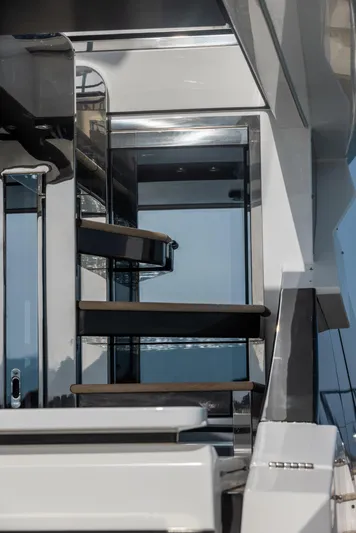  Yacht Photos Pics Staircase on 2018 Azimut S7 yacht, featuring sleek modern design and reflective surfaces.