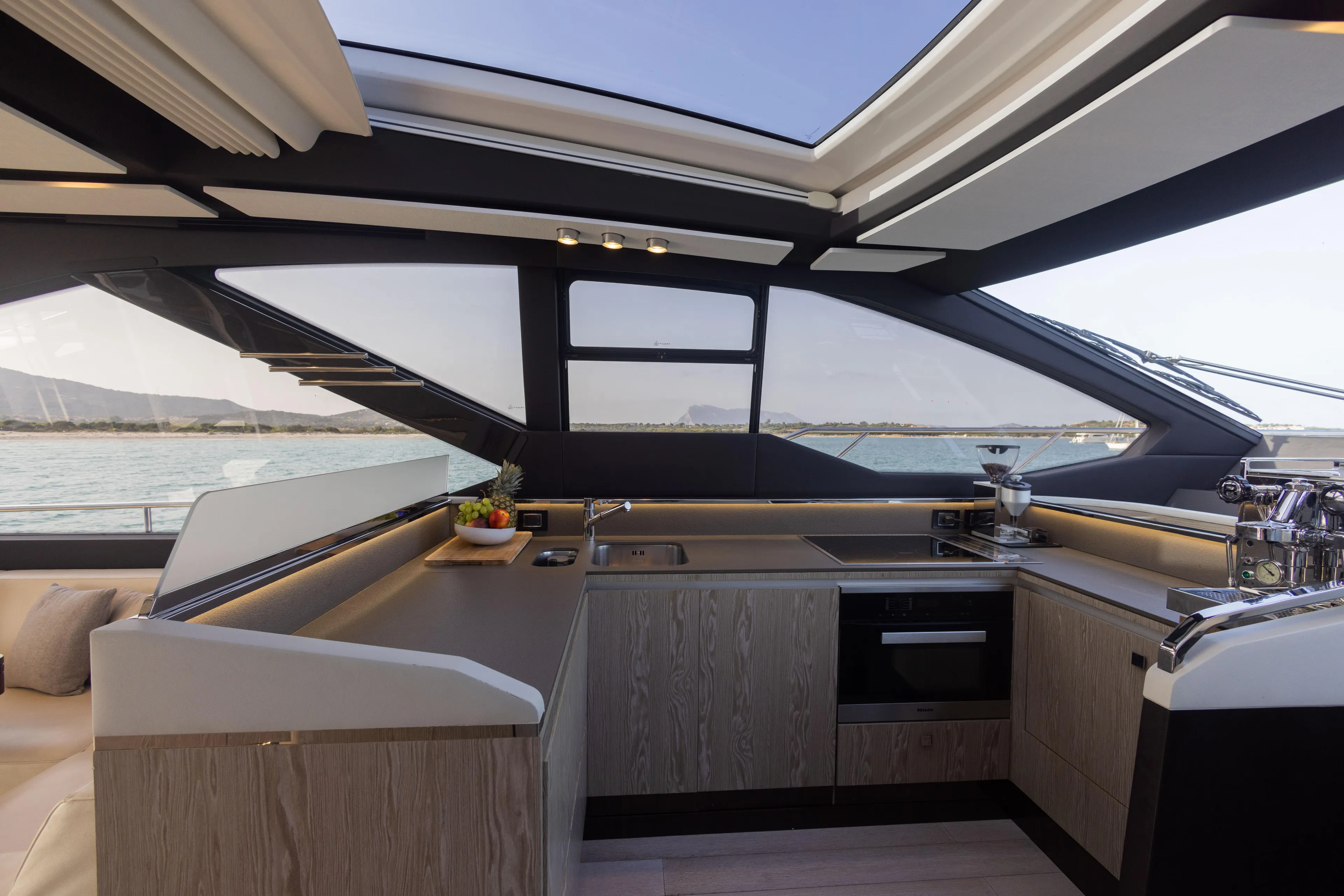  Yacht Photos Pics Luxurious kitchen interior of 2018 Azimut S7 yacht with modern design and panoramic windows.