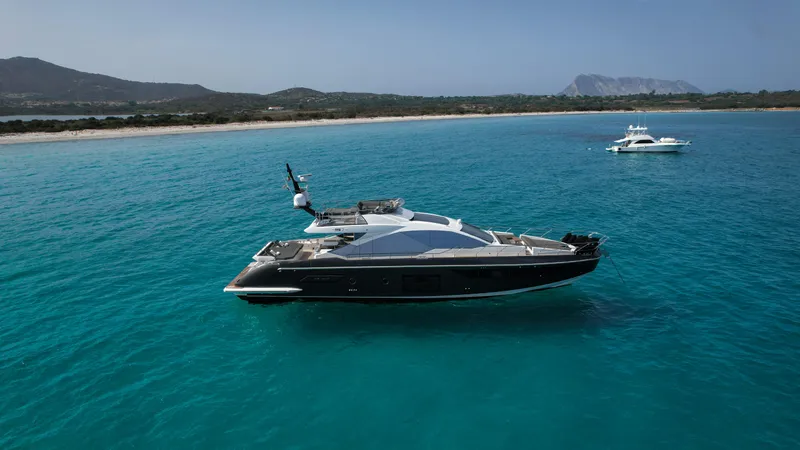  Yacht Photos Pics Luxury 2018 Azimut S7 yacht on turquoise waters near scenic coastline.
