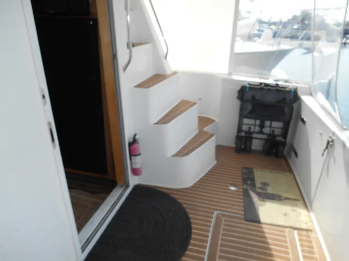 Lucky Yacht Photos Pics 2001 Californian 39 yacht interior with stairs, fire extinguisher, and deck mat.