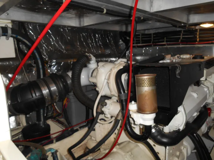 Lucky Yacht Photos Pics Engine room of a 2001 Californian 39 yacht, featuring complex machinery and wiring.