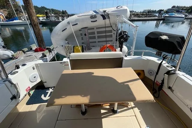  Yacht Photos Pics 2017 Ranger Tugs R-31 S boat deck with table, docked at marina.