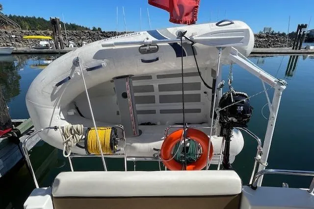  Yacht Photos Pics 2017 Ranger Tugs R-31 S with dinghy and outboard motor at a marina.