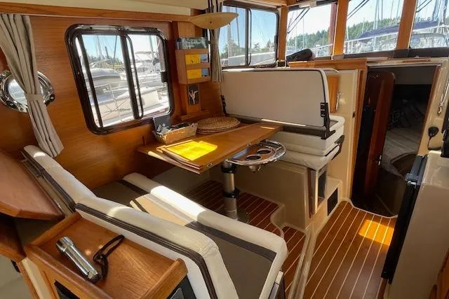  Yacht Photos Pics 2017 Ranger Tugs R-31 S interior with wood accents and dining area.