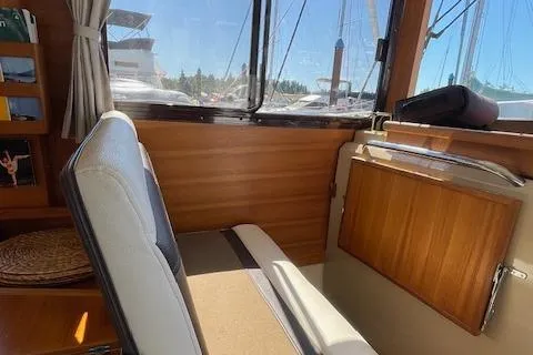  Yacht Photos Pics Interior of 2017 Ranger Tugs R-31 S boat with wooden paneling and seating.