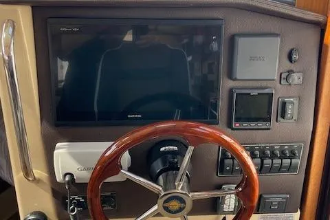  Yacht Photos Pics 2017 Ranger Tugs R-31 S helm with Garmin display and wooden steering wheel.