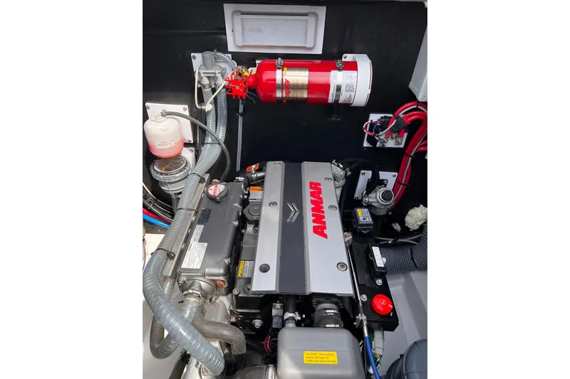Tamboo Yacht Photos Pics Engine compartment of a 2023 Bali 4.2 boat with Yanmar engine and fire extinguisher.