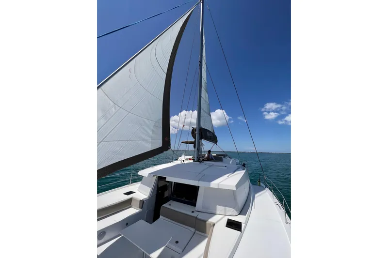 Tamboo Yacht Photos Pics Sailing on a 2023 Bali 4.2 catamaran under clear blue skies.