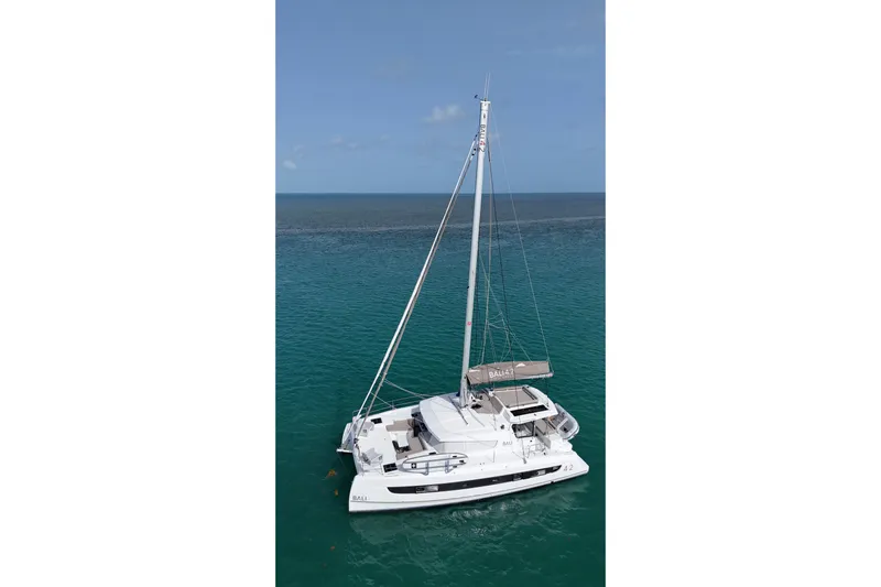 Tamboo Yacht Photos Pics 2023 Bali 4.2 catamaran sailing on clear blue ocean waters.