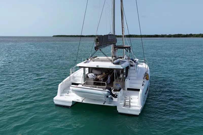 Tamboo Yacht Photos Pics 2023 Bali 4.2 catamaran sailing on calm blue waters.