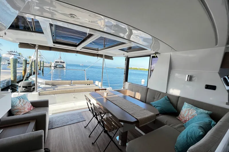 Tamboo Yacht Photos Pics Luxurious interior of 2023 Bali 4.2 catamaran with ocean view and comfortable seating.