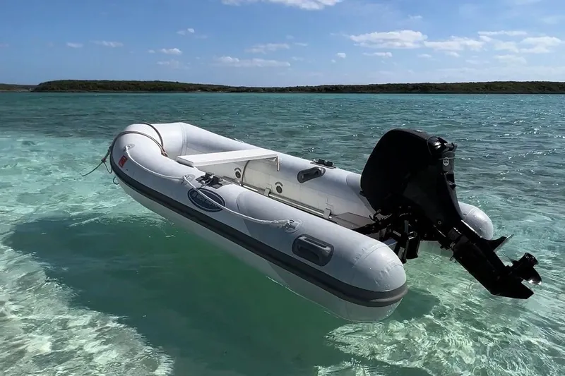 Tamboo Yacht Photos Pics Inflatable Bali 4.2 boat, 2023 model, floating on clear turquoise water.