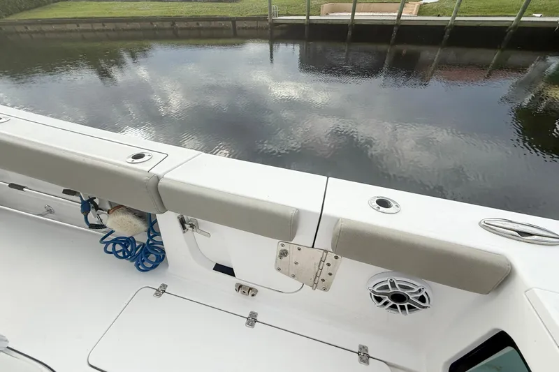  Yacht Photos Pics 2023 Sportsman Open 322 Center Console boat interior with seating and water view.