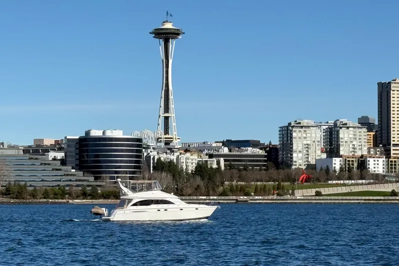  Yacht Photos Pics 2004 Meridian 411 Sedan yacht cruising near Seattle's Space Needle on a sunny day.