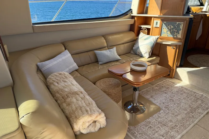  Yacht Photos Pics Luxurious interior of 2004 Meridian 411 Sedan yacht with leather seating and ocean view.