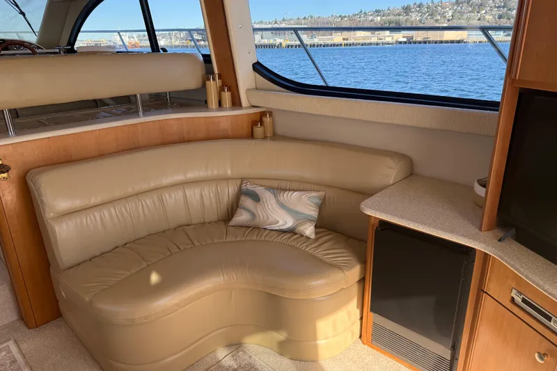  Yacht Photos Pics Luxurious interior of 2004 Meridian 411 Sedan yacht with leather seating and scenic window view.