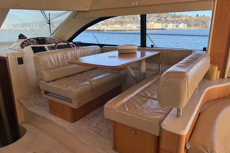  Yacht Photos Pics Luxurious interior of a 2004 Meridian 411 Sedan yacht with leather seating and scenic water view.