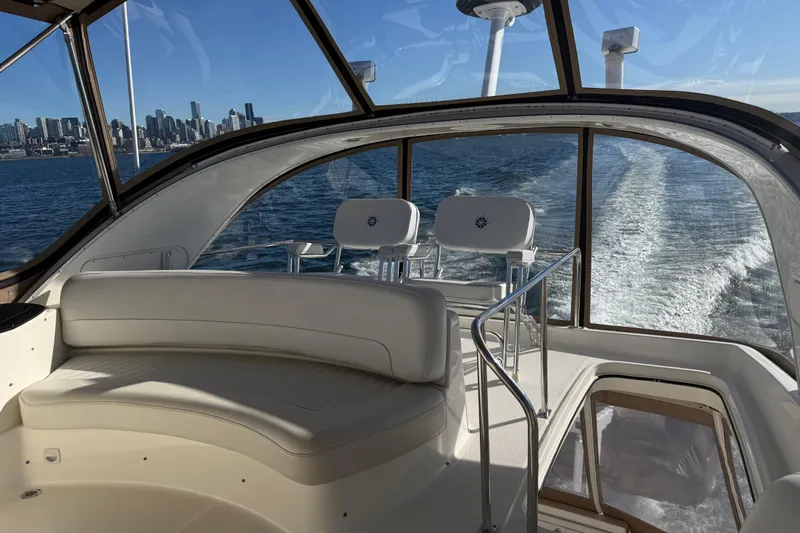  Yacht Photos Pics 2004 Meridian 411 Sedan interior with city skyline and ocean view.