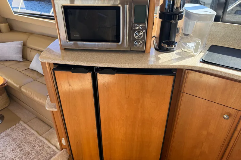  Yacht Photos Pics Kitchen area in a 2004 Meridian 411 Sedan yacht with microwave and coffee maker.