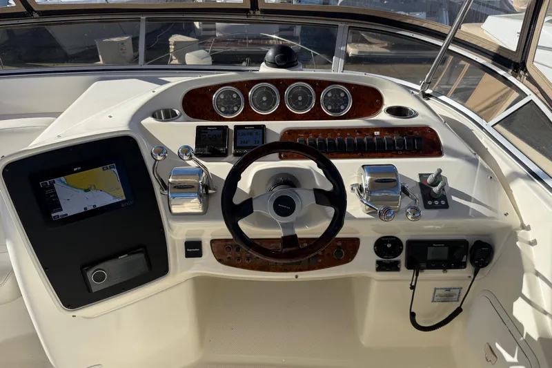  Yacht Photos Pics Cockpit of 2004 Meridian 411 Sedan with navigation and control instruments.